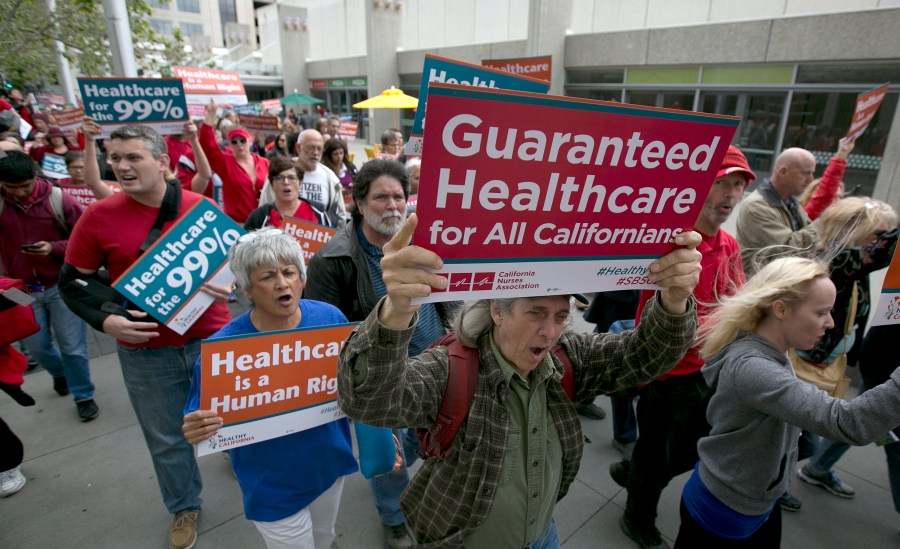 Supporters of single-payer health care march to the Capitol, Wednesday, April 26, 2017, in Sacramento, Calif. On Monday, Jan. 31, 2022, California Democrats face a deadline to advance a bill that would create a government-funded universal health care system. The proposal has the support of some Democratic leaders and powerful labor union, but it faces strong opposition from business groups who say it would cost too much. (AP Photo/Rich Pedroncelli, File)