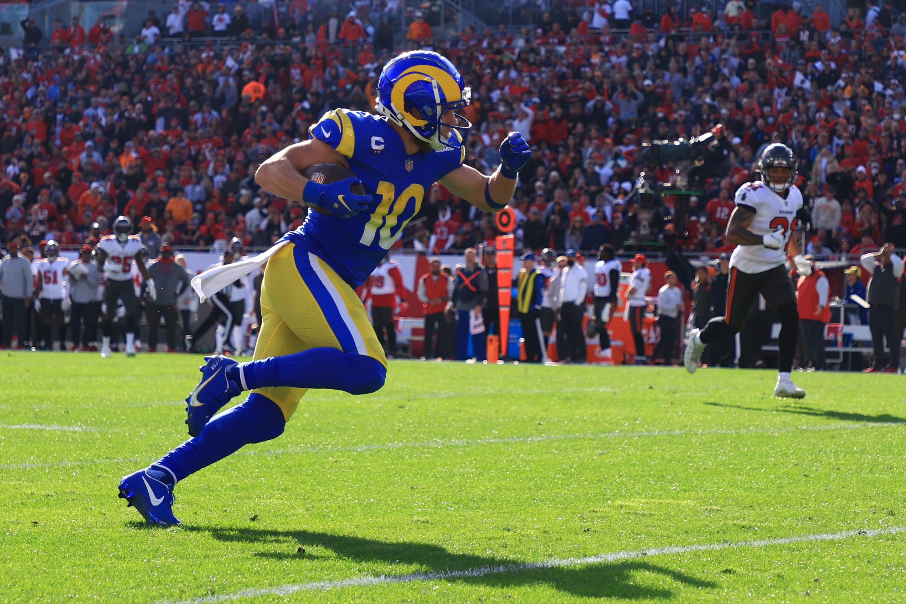 Cooper Kupp of the Los Angeles Rams runs with the ball for a touchdown in the second quarter of the game against the Tampa Bay Buccaneers in the NFC Divisional Playoff game at Raymond James Stadium on Jan. 23, 2022, in Tampa, Florida. (Mike Ehrmann/Getty Images)