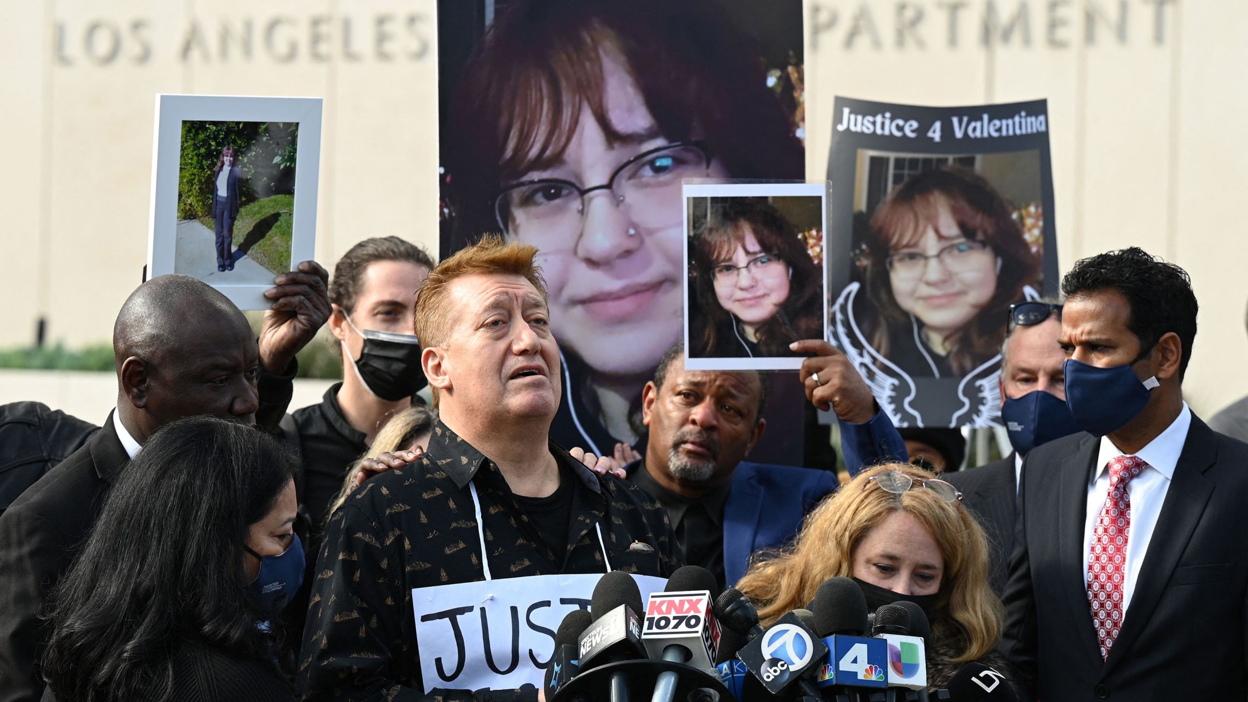 Soledad Peralta and Juan Pablo Orellana Larenas, parents of 14-year old Valentina Orellana-Peralta, who was killed by a stray police bullet while shopping at a clothing store, attend a press conference outside LAPD headquarters in Los Angeles on Dec. 28, 2021. (Robyn Beck AFP via Getty Images)