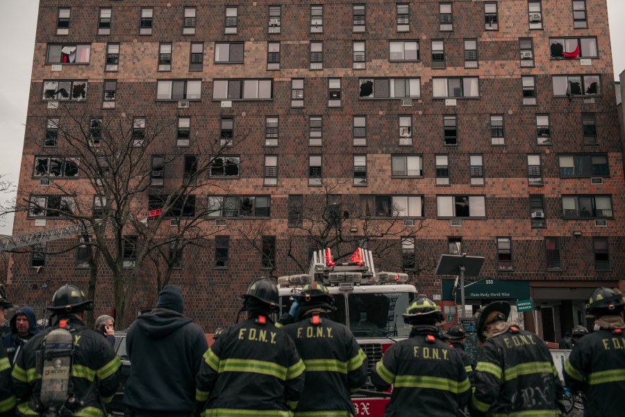 Emergency first responders remain at the scene after an intense fire at a 19-story residential building that erupted in the morning on January 9, 2022 in the Bronx borough of New York City. (Photo by Scott Heins/Getty Images)