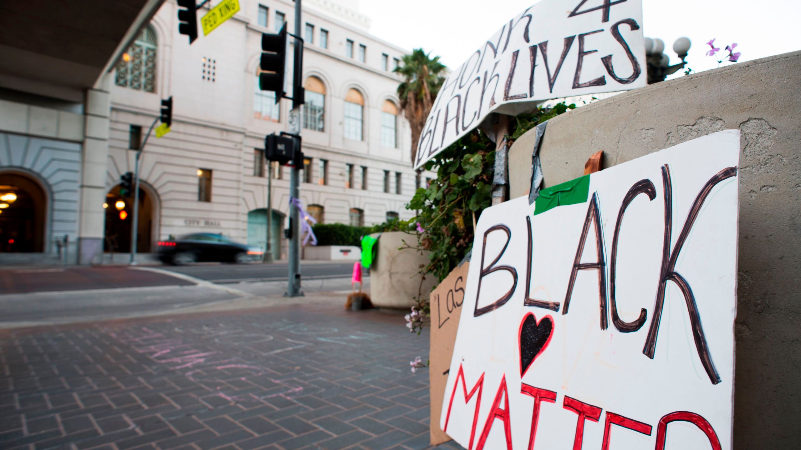 A sign reading "Honk 4 Black Lives" is seen at an encampment of activists associated with the Black Lives Matter movement, outside Los Angeles City Hall on Aug. 13, 2016. (ROBYN BECK/AFP via Getty Images)