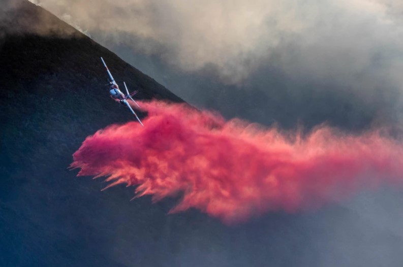 An air tanker drops retardant on the Colorado fire burning near Big Sur on Jan. 22, 2022. (Karl Mondon/Bay Area News Group)