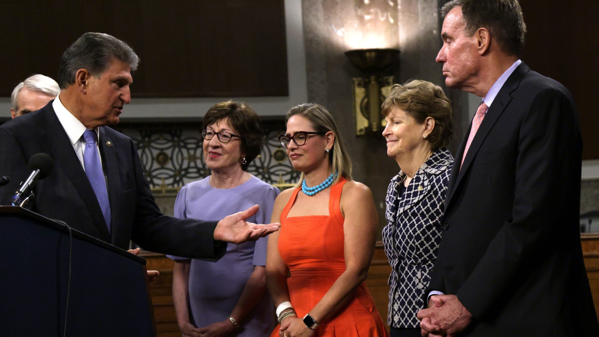 (L-R) U.S. Sen. Joe Manchin (D-WV) speaks as Sen. Susan Collins (R-ME), Sen. Kyrsten Sinema (D-AZ), Sen. Jeanne Shaheen (D-NH) and Sen. Mark Warner (D-VA) listen during a news conference after a procedural vote for the bipartisan infrastructure framework at Dirksen Senate Office Building July 28, 2021 on Capitol Hill in Washington, DC (Alex Wong/Getty Images)