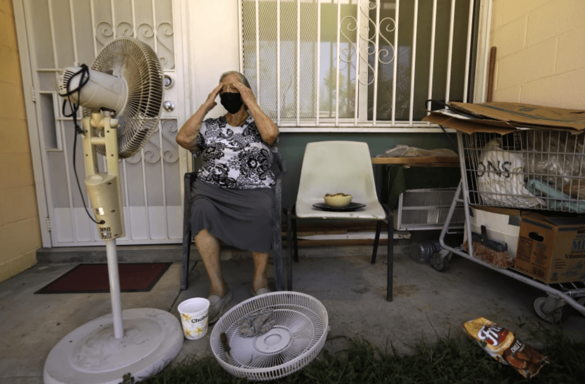 Felisa Benitez, 86, takes a break on the porch of her Pacoima home on a 99-degree day in August 2021. The Newsom administration has announced a plan for addressing extreme heat. (Genaro Molina / Los Angeles Times)