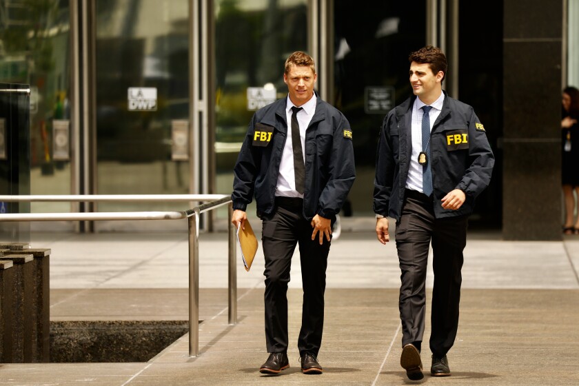 FBI agents leave the downtown Department of Water and Power headquarters in 2019. (Al Seib / Los Angeles Times)