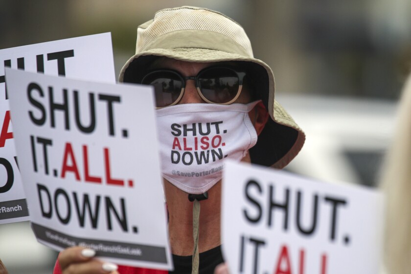 Deirdre Bolona, from Aliso Moms Alliance, is seen during a September 2021 rally in Porter Ranch, calling for the closure of the Aliso Canyon gas storage facility. (Irfan Khan / Los Angeles Times)