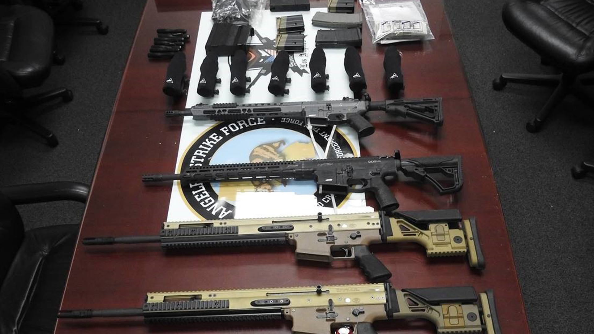 Some of the guns seized by federal officials are shown in a photo from the U.S. Attorney's Office for the Central District of California on Jan. 24, 2022.