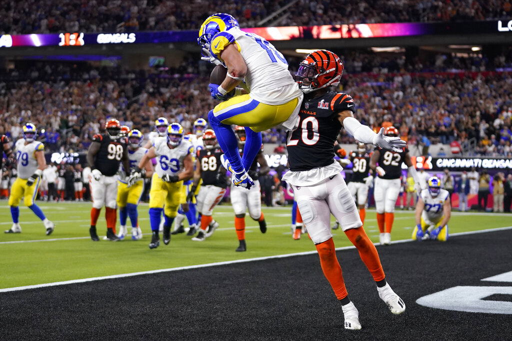 Los Angeles Rams wide receiver Cooper Kupp, top, catches a touchdown against Cincinnati Bengals cornerback Eli Apple during the second half of the NFL Super Bowl 56 football game Sunday, Feb. 13, 2022, in Inglewood, Calif. (AP Photo/Marcio Jose Sanchez)