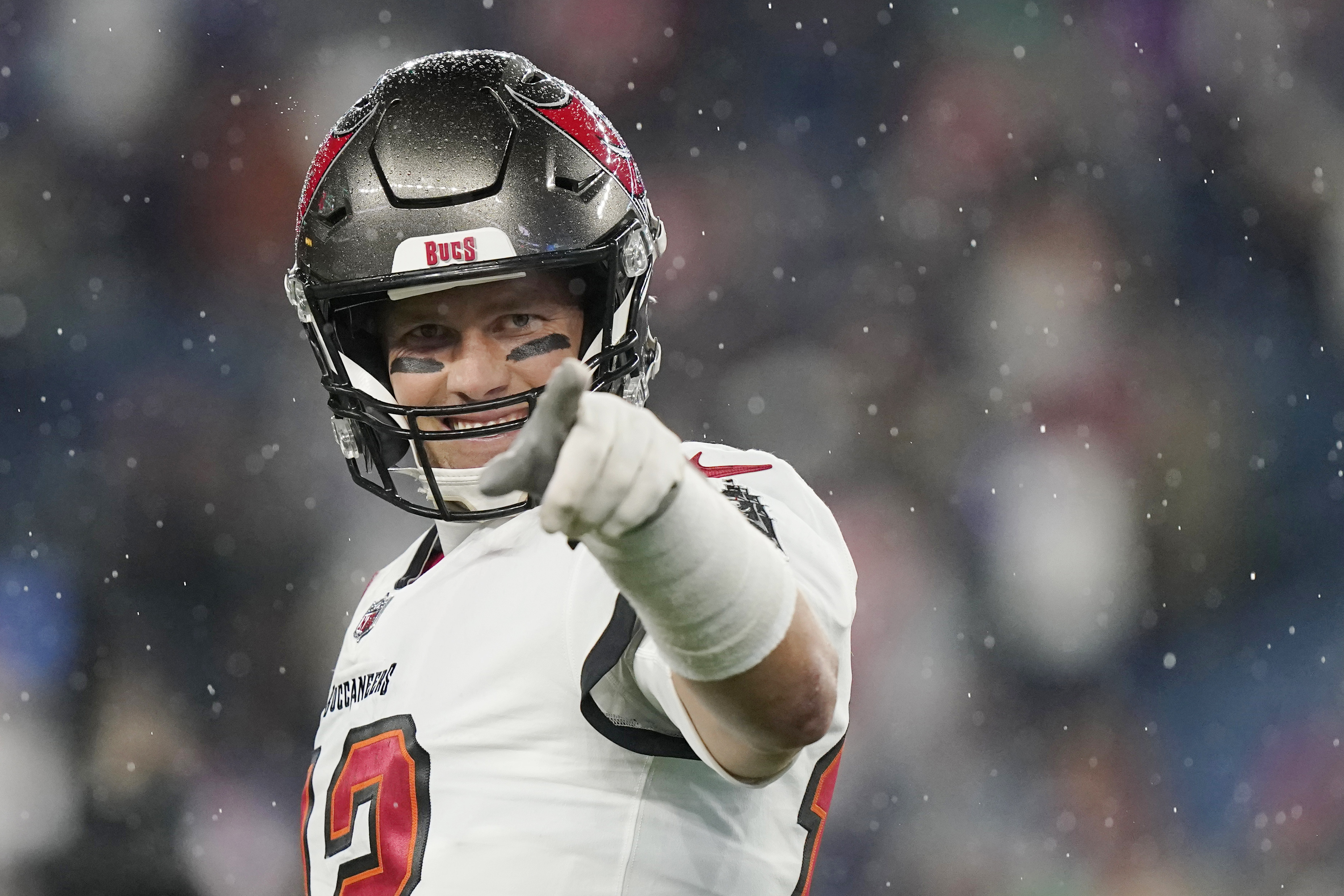 Tampa Bay Buccaneers quarterback Tom Brady (12) points toward the sidelines prior to an NFL football game between the New England Patriots and Tampa Bay Buccaneers on Oct. 3, 2021, in Foxborough, Mass. (Steven Senne/Associated Press)