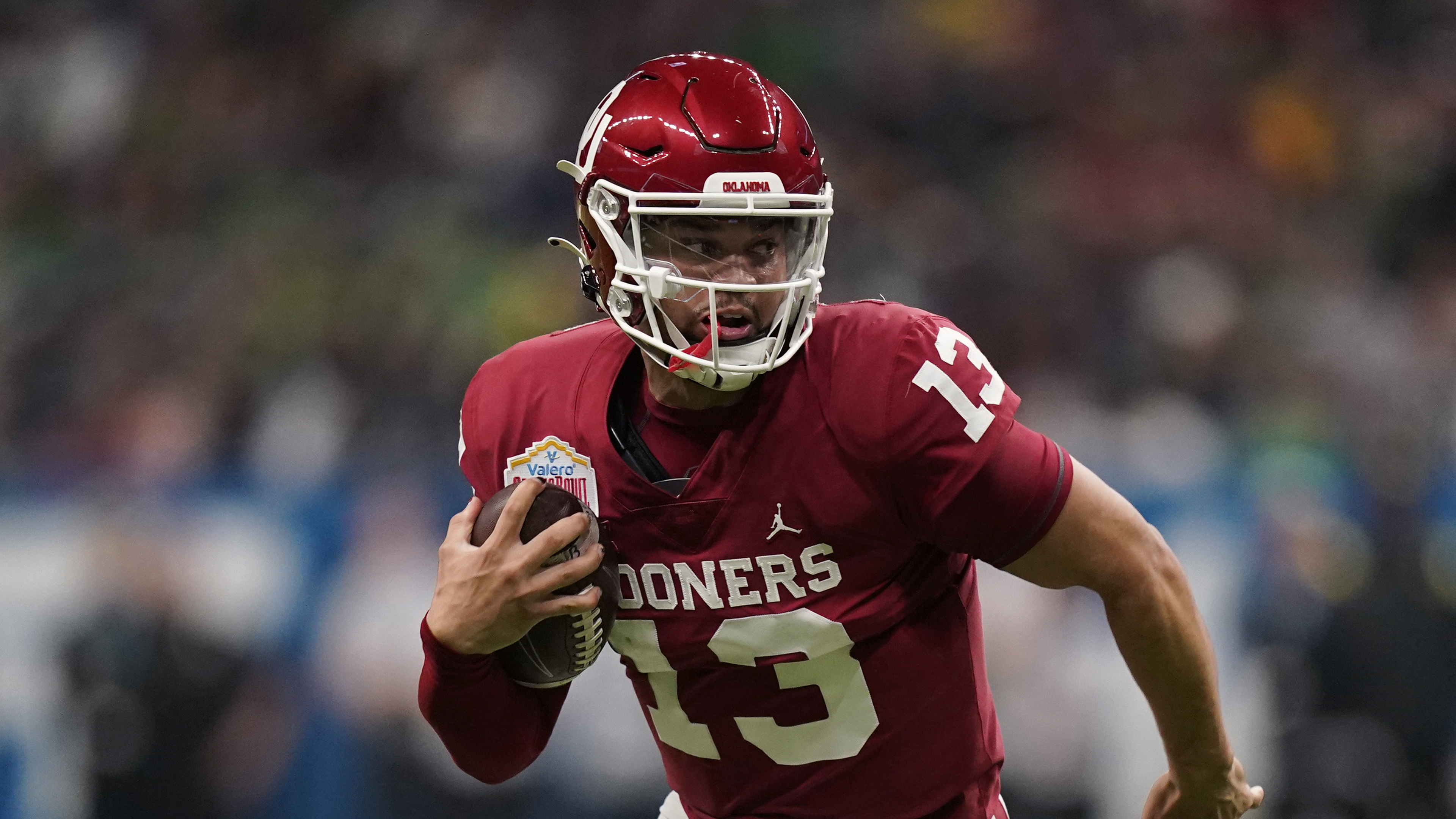 Oklahoma quarterback Caleb Williams (13) during the first half of the Alamo Bowl NCAA college football game against Oregon, Wednesday, Dec. 29, 2021, in San Antonio. (AP Photo/Eric Gay)