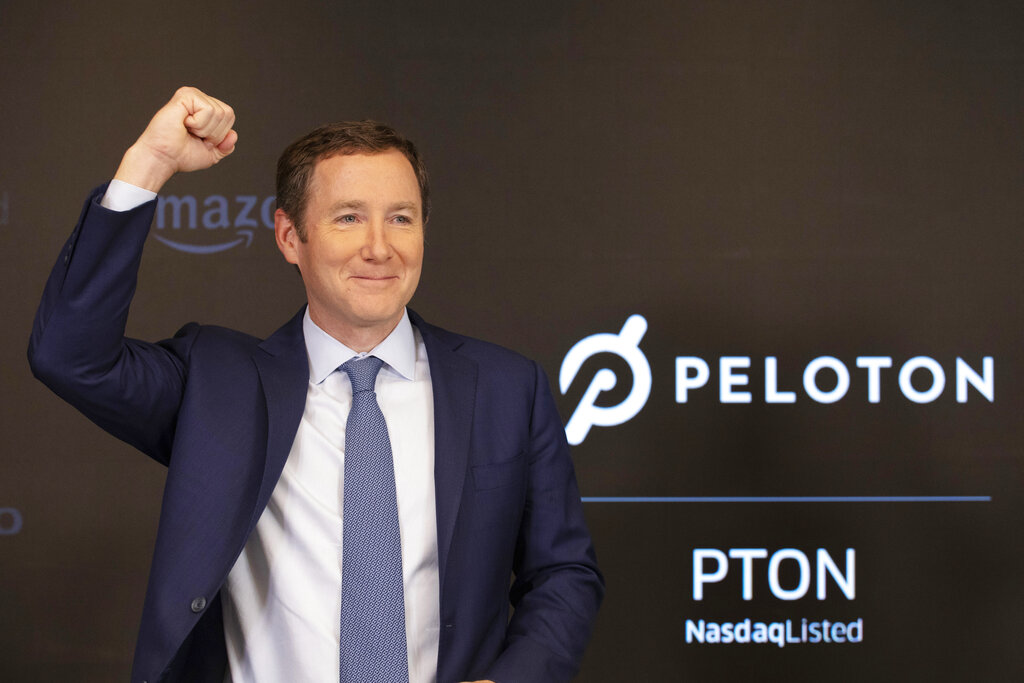 Peloton CEO John Foley celebrates at the Nasdaq MarketSite before the opening bell and his company's IPO, Sept. 26, 2019 in New York. (AP Photo/Mark Lennihan, file)