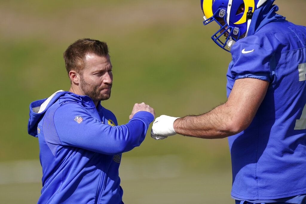 Los Angeles Rams head coach Sean McVay, left, greets offensive tackle Andrew Whitworth during an NFL football practice Friday, Jan. 28, 2022, in Thousand Oaks, Calif., ahead of their NFC championship game against the San Francisco 49ers on Sunday. (AP Photo/Mark J. Terrill)