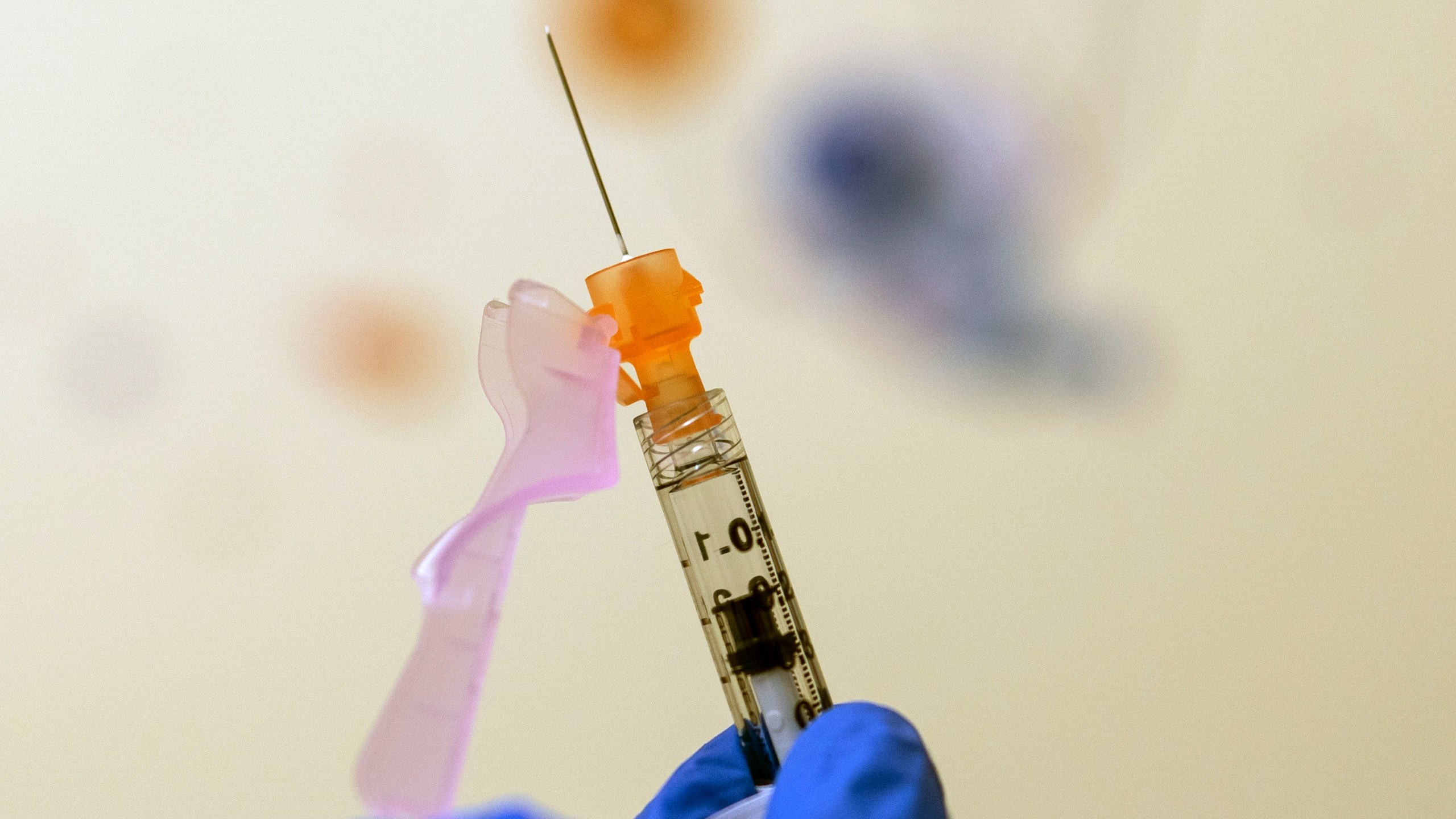 A nurse prepares a child's COVID-19 vaccine dose at Children's National Hospital in Washington on Nov. 3, 2021. (Carolyn Kaster/Associated Press)