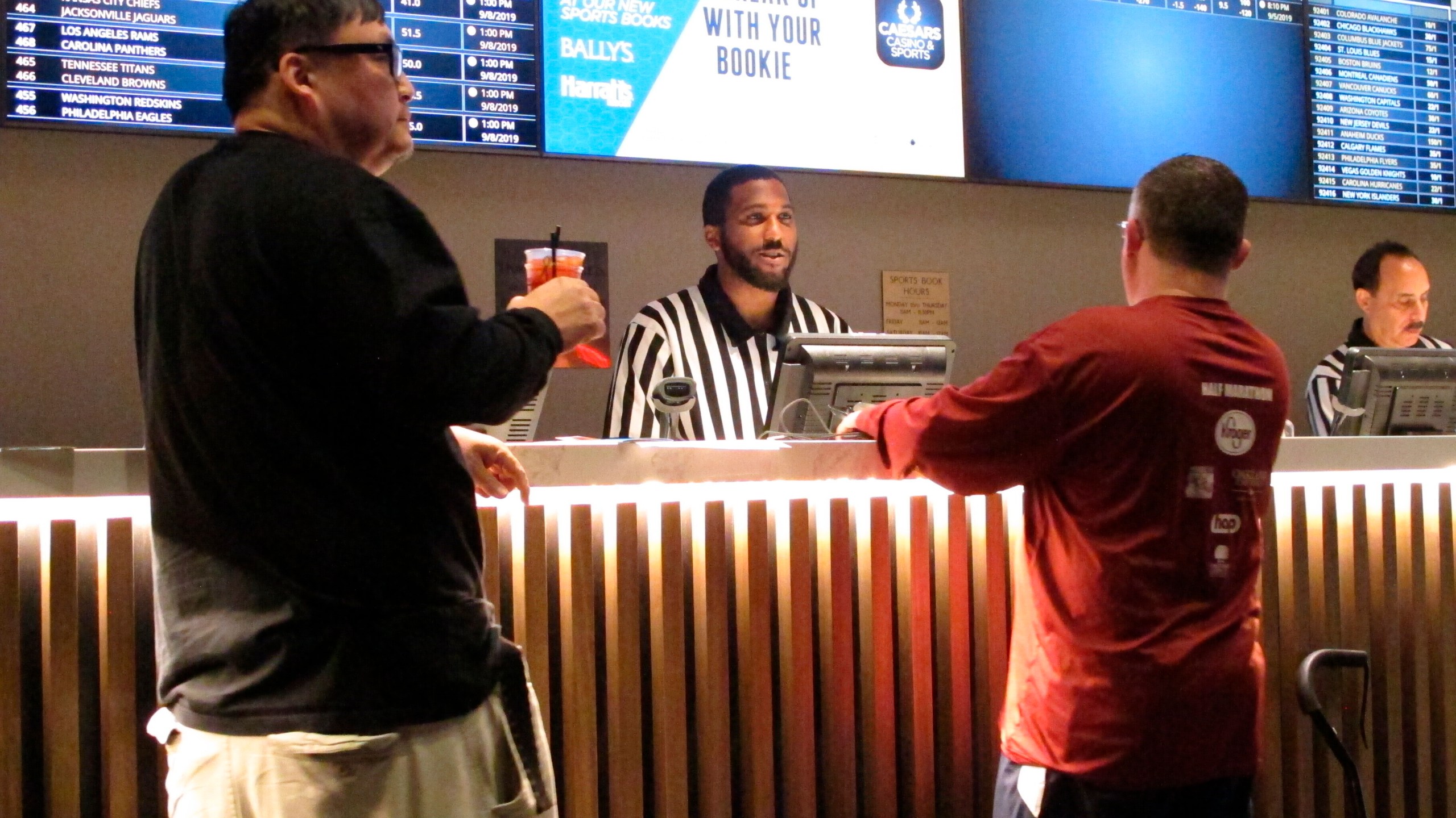 A gambler makes a sports bet at Bally's casino in Atlantic City N.J., Sept. 5, 2019. A record 31.5 million Americans plan to bet on this year's Super Bowl, according to the gambling industry's national trade group. The American Gaming Association on Tuesday, Feb. 8, 2022, released its annual predictions for wagering on pro football's championship game, forecasting that over $7.6 billion will be bet legally and otherwise. (AP Photo/Wayne Parry, File)