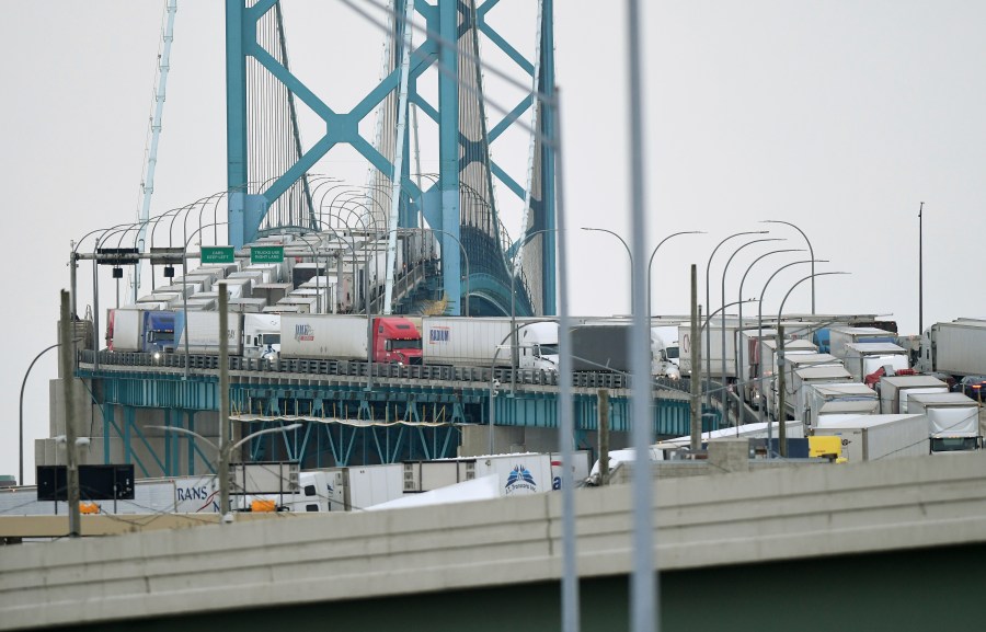 Trucks are backed up heading to and from Canada on the Ambassador Bridge, due to protests on the Windsor side, in Detroit on Monday, Feb. 7, 2022. Canada's public safety minister said Monday that U.S. officials should stay out of his country's domestic affairs, joining other Canadian leaders in pushing back against prominent Republicans who offered support for the protests of COVID-19 restrictions that have besieged downtown Ottawa for more than a week. (Daniel Mears /Detroit News via AP)