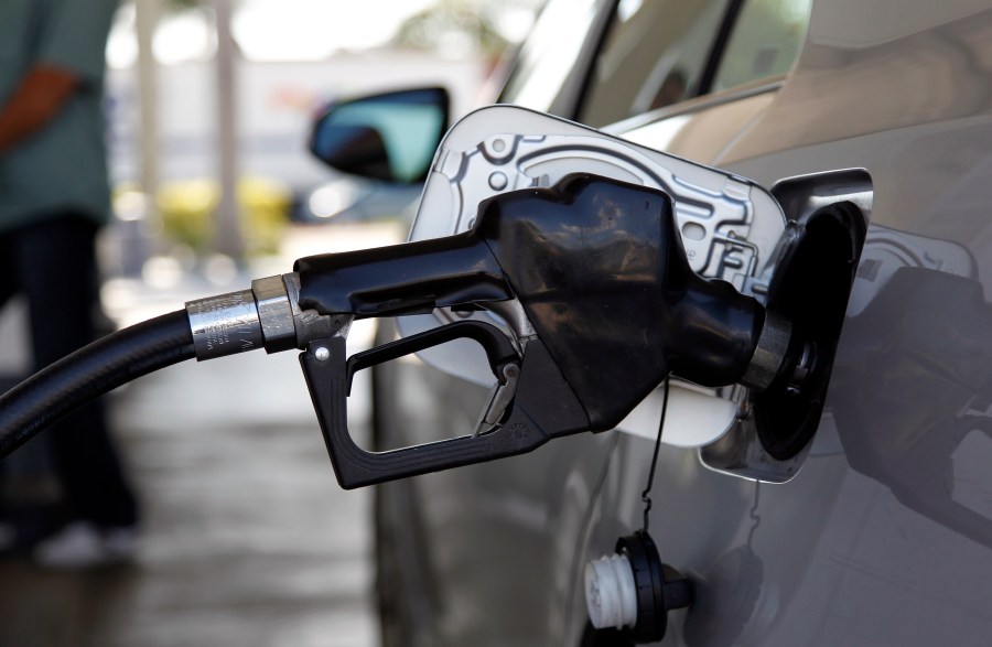 Fuel is pumped into a vehicle, Thursday, June 14, 2012, in Miami. Two Democratic senators are calling for suspending the federal gas tax for the remainder of 2022 to help consumers struggling with rising fuel prices (AP Photo/Lynne Sladky, File)