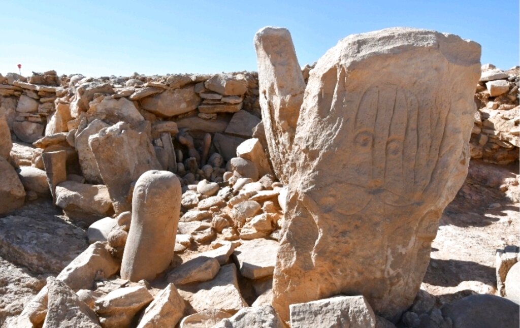 This photo provided by Jordan Tourism Ministry shows two carved standing stones at a remote Neolithic site in Jordan’s eastern desert. (Tourism Ministry via AP)