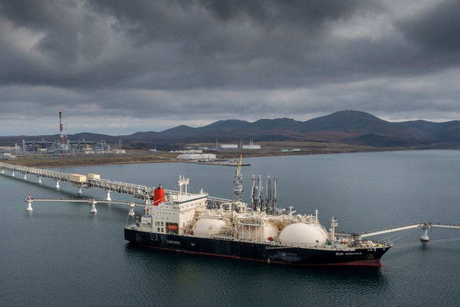 The tanker Sun Arrows loads its cargo of liquefied natural gas from the Sakhalin-2 project in the port of Prigorodnoye, Russia, Oct. 29, 2021. There is a glaring carve-out in President Joe Biden's sanctions against Russia: Oil and natural gas from that country will continue to flow freely to the rest of the world and money will keep flowing into Russia. (AP Photo, File)