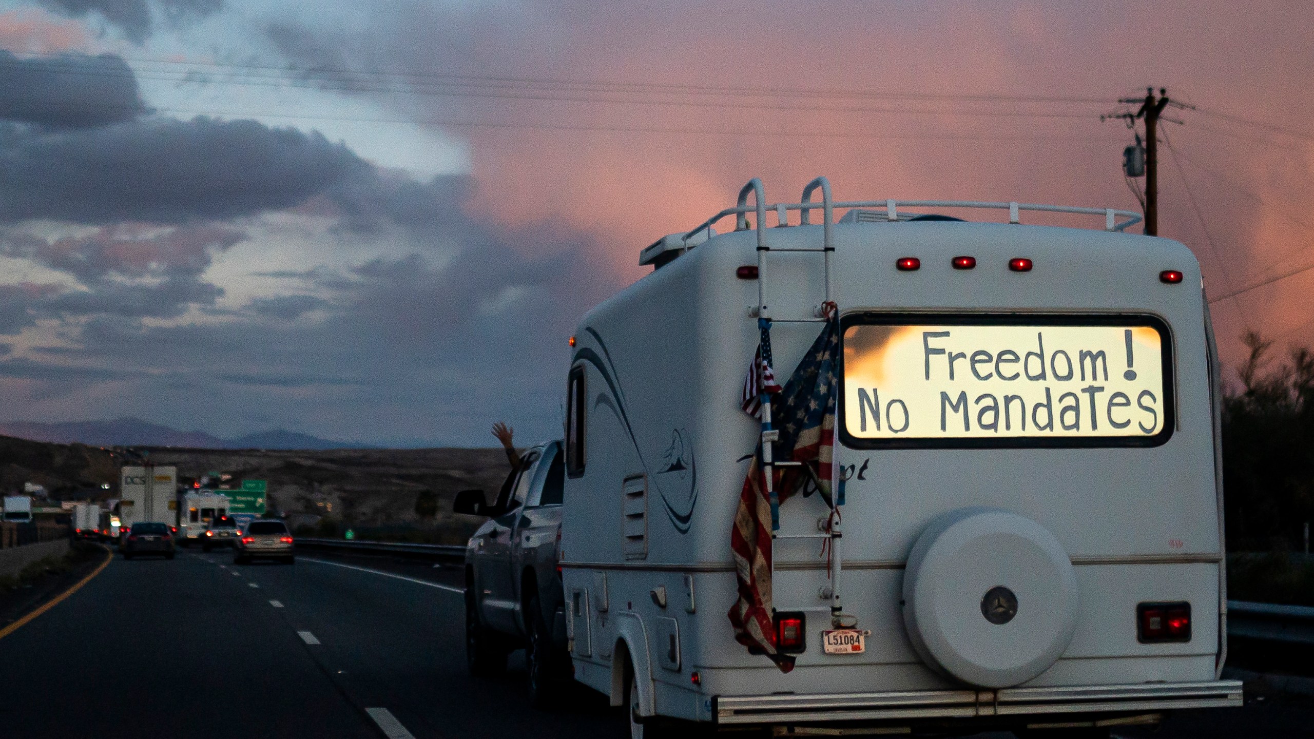 A trailer with the words "Freedom! No Mandate" on its back window is shown in Needles, Calif. as it heads toward Washington D.C. to protest COVID-19 on Feb. 23, 2022. (Nathan Howard/Associated Press)