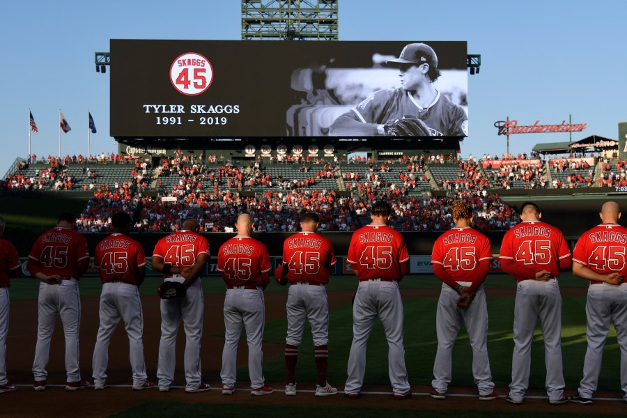 The Los Angeles Angels of Anaheim stand for a moment of silence before they play the Seattle Mariners at Angel Stadium of Anaheim on July 12, 2019. (John McCoy/Getty Images