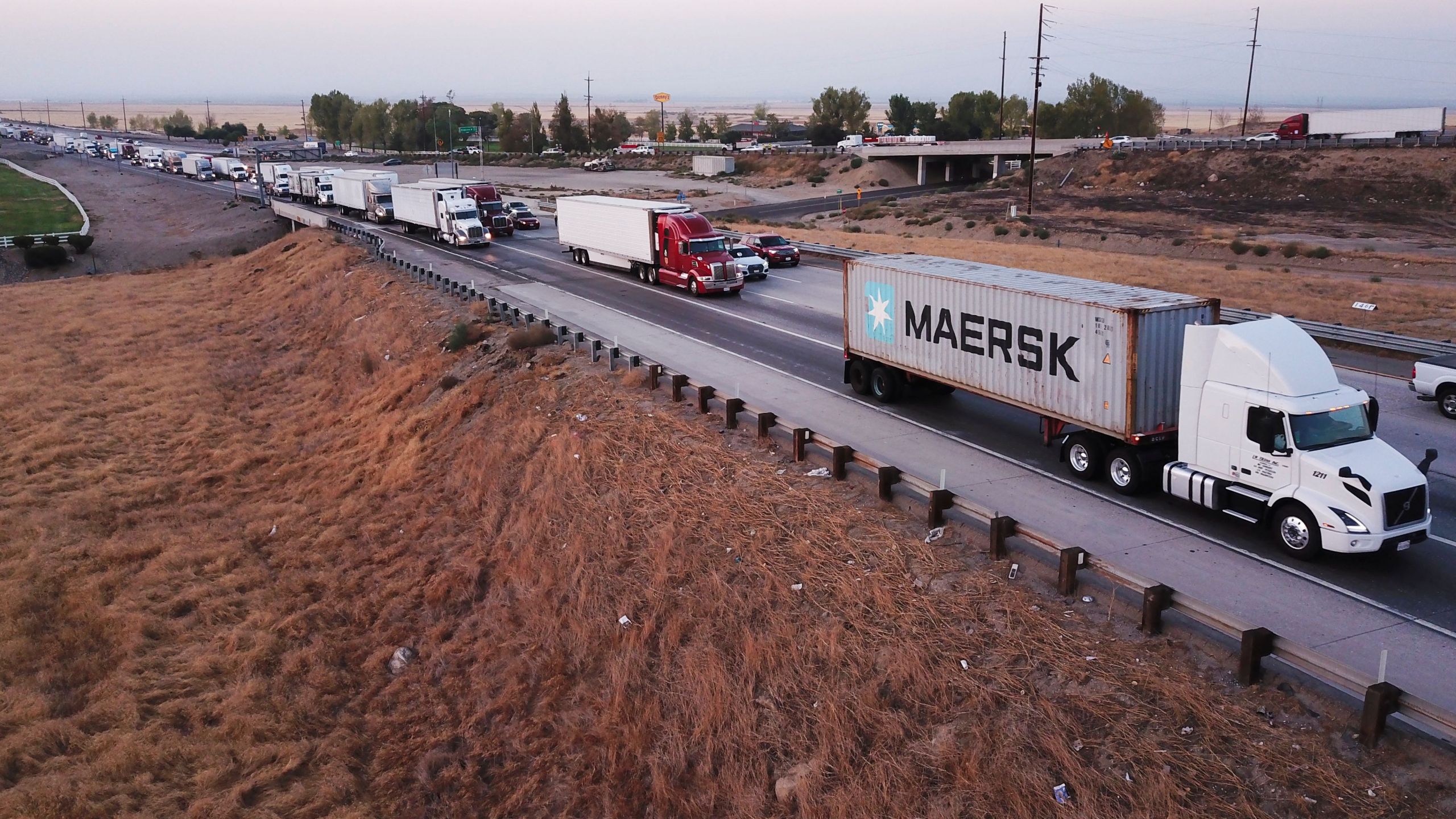 An aerial picture taken on August 26, 2021, shows trucks, cars, and other vehicles sitting in traffic due to road construction on Interstate 5 as they transit through the Tejon Pass from the Grapevine in Kern County, California. (PATRICK T. FALLON/AFP via Getty Images)