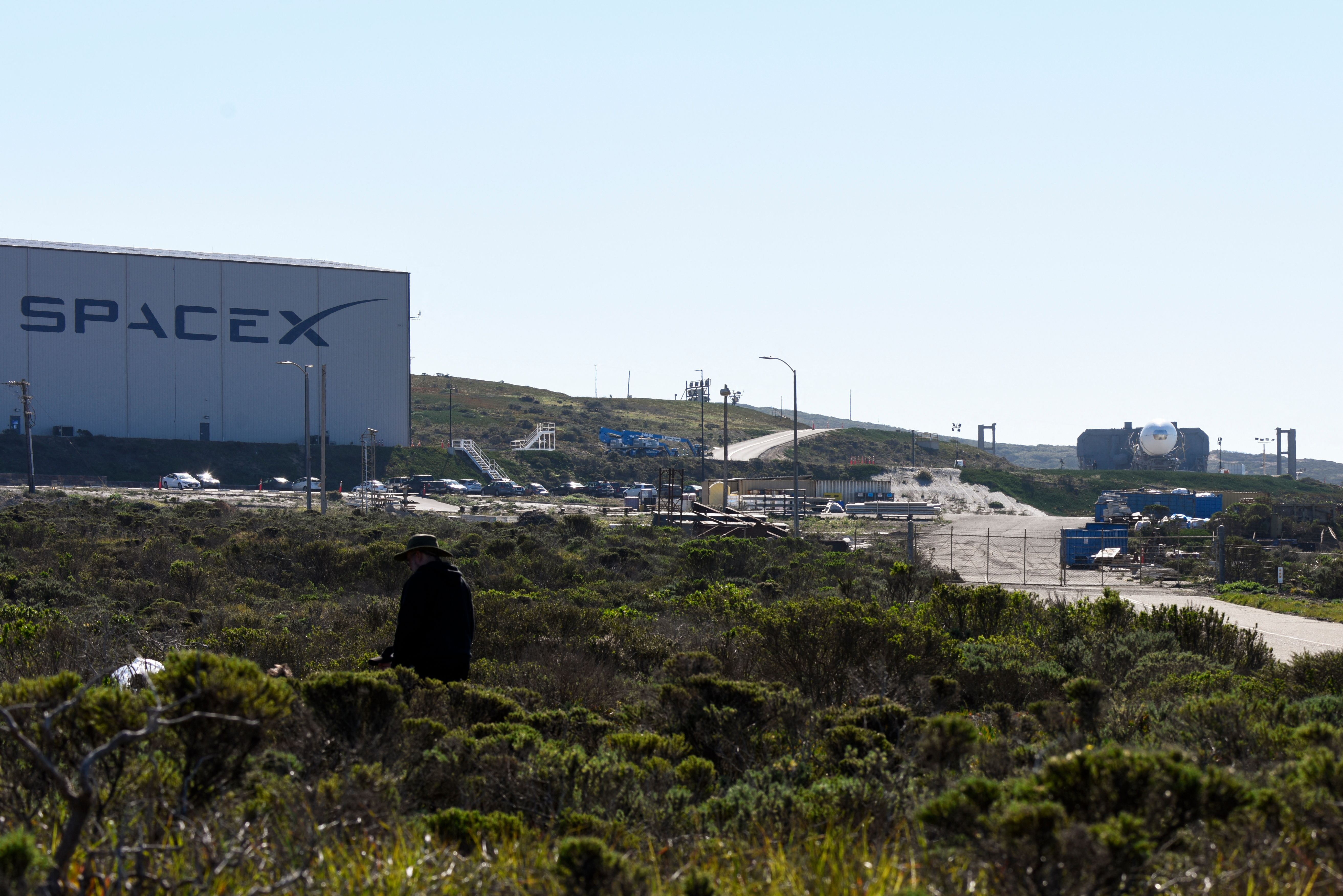 A Space Exploration Technologies Corp. (SpaceX) Falcon 9 rocket (R) with a payload for the National Reconnaissance Office is seen at the SLC-4E launch pad ahead of the NROL-87 launch from the Vandenberg U.S. Space Force Base in Lompoc on Feb. 1, 2022. (Patrick T. FALLON / AFP via Getty Images)