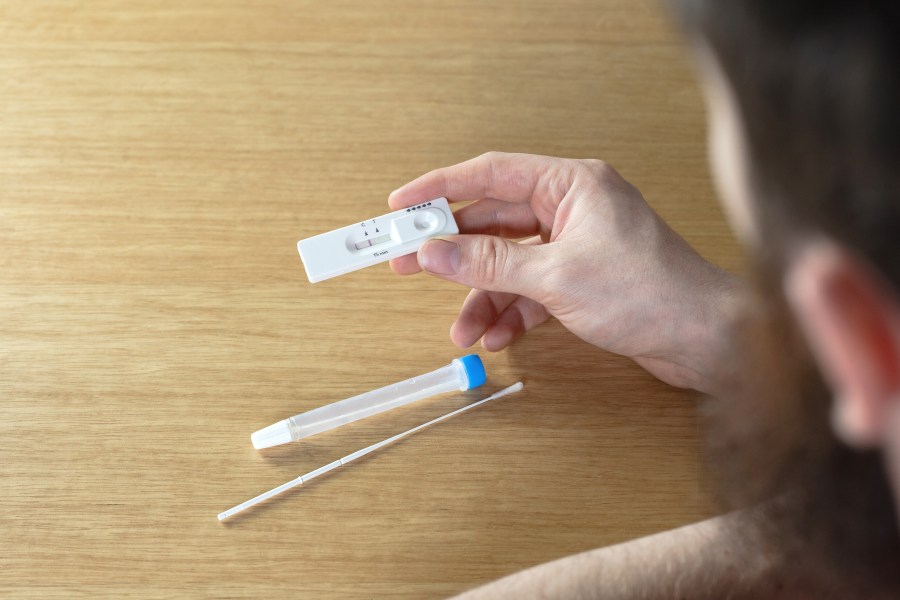 A person looks at an at-home COVID-19 test in this file photo.(Getty Images)