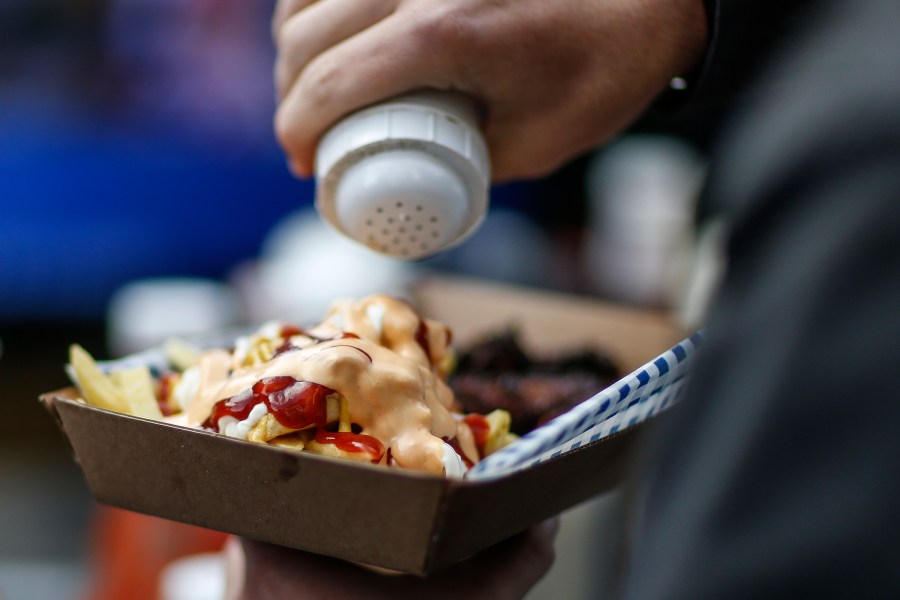 A fan enjoys food before kick off during the NFL match between the Arizona Cardinals and the Los Angeles Rams at Twickenham Stadium on Oct. 22, 2017. (Alan Crowhurst/Getty Images)