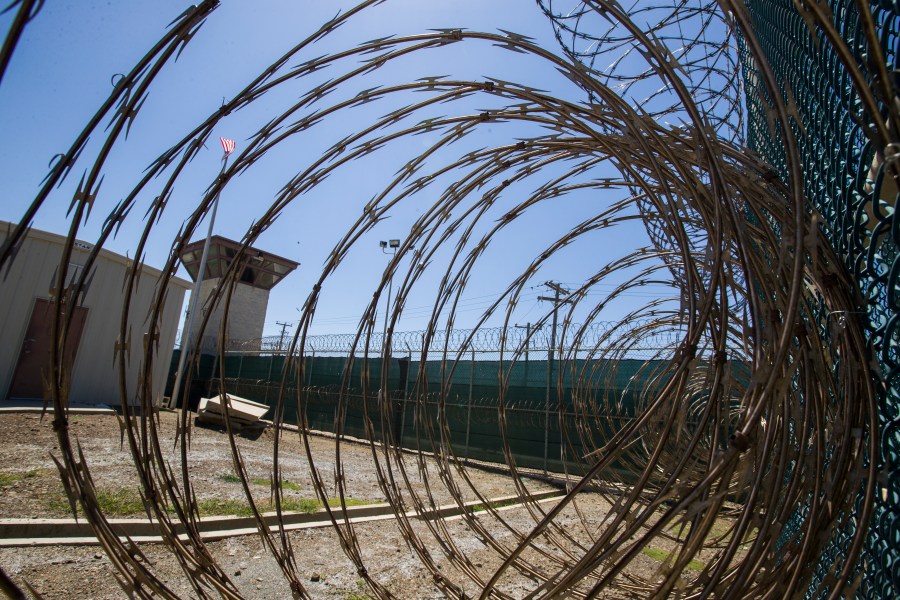 In this April 17, 2019, photo, reviewed by U.S. military officials, the control tower is seen through the razor wire inside the Camp VI detention facility in Guantanamo Bay Naval Base, Cuba. The Biden administration has been quietly laying the groundwork to release prisoners from the Guantanamo Bay detention center and at least move closer to being able to shut it down. (AP Photo/Alex Brandon, File)