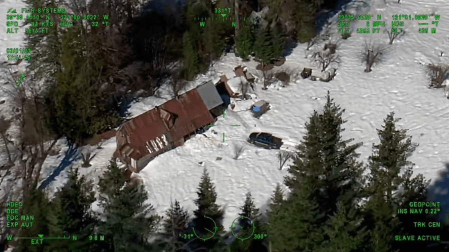 CHP on Feb. 2 shared this image of a Sierra Nevada cabin where two people and a dog were snowed in.