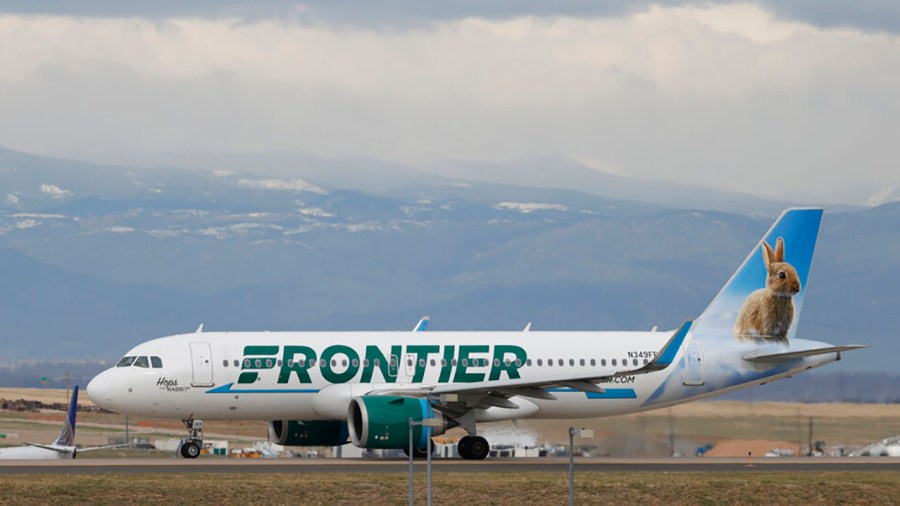 A Frontier Airlines jetliner taxis to a runway to take off from Denver International Airport Thursday, April 23, 2020, in Denver. (AP Photo/David Zalubowski, File)