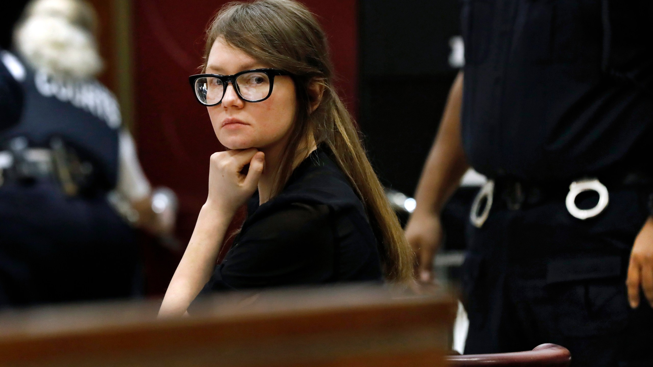 Anna Sorokin sits at the defense table during jury deliberations in her trial at New York State Supreme Court, April 25, 2019, in New York. Sorokin, the convicted swindler who claimed to be a German heiress to finance a posh lifestyle in New York, is making a new bid to fight deportation, her lawyer said Tuesday, March 15, 2022. (AP Photo/Richard Drew, File)