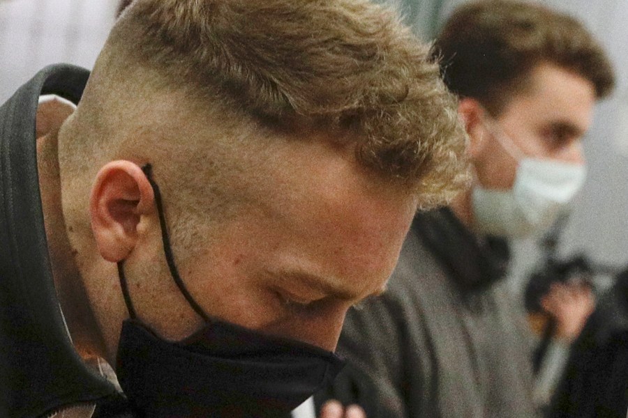 Finnegan Lee Elder and his co-defendant Gabriel Natale-Hjorth, right, listen as the verdict is read in Rome on May 5, 2021, in the trial for the slaying of an Italian plainclothes police officer in Rome in summer 2019. (Gregorio Borgia/Associated Press)