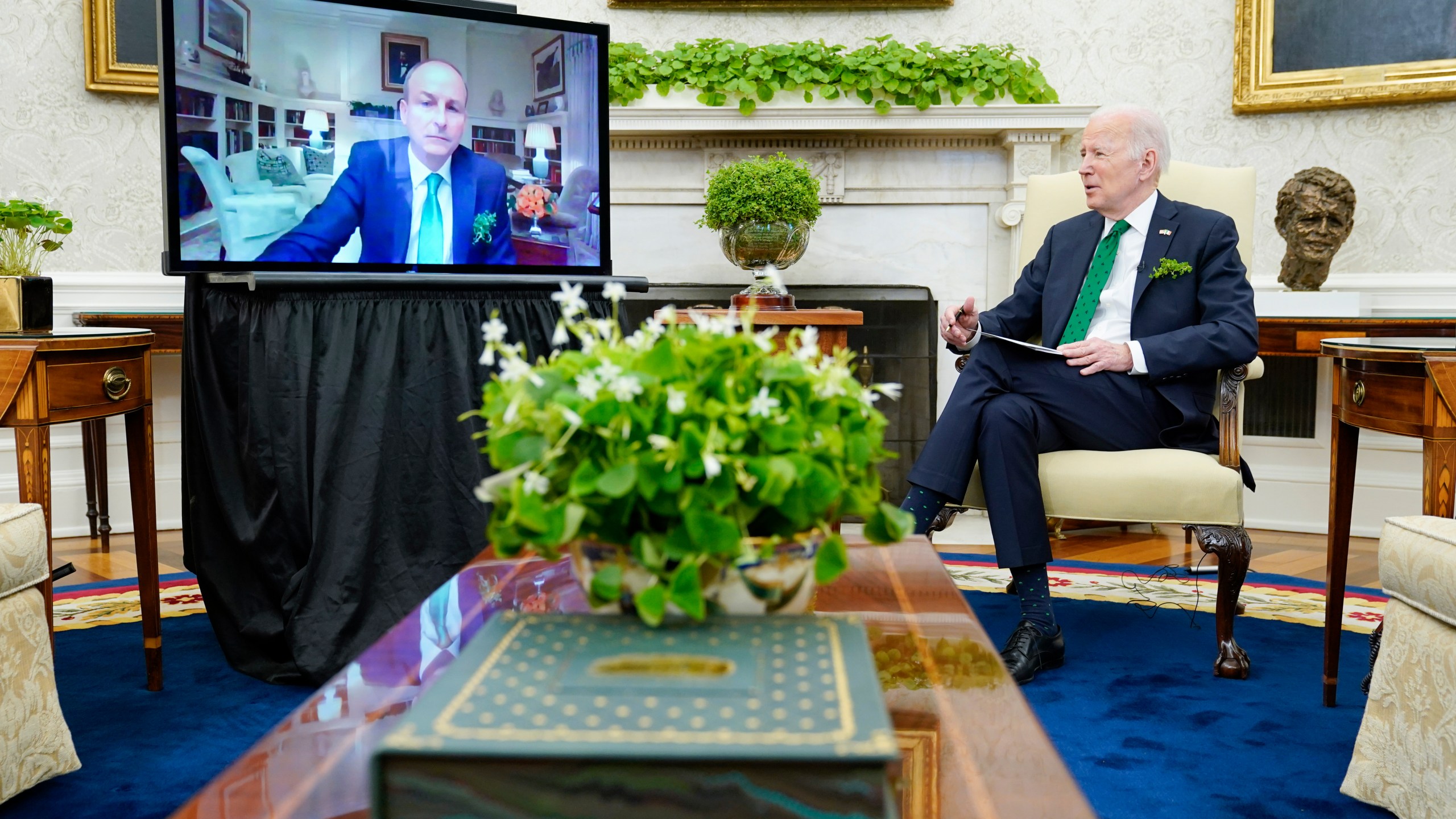 President Joe Biden meets virtually with Irish Prime Minister Micheál Martin in the Oval Office of the White House on March 17, 2022. Martin tested positive for COVID-19 the day before. (Patrick Semansky/Associated Press)