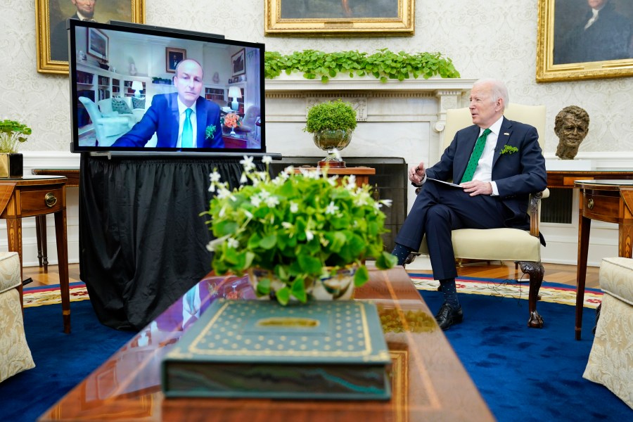 President Joe Biden meets virtually with Irish Prime Minister Micheál Martin in the Oval Office of the White House on March 17, 2022. Martin tested positive for COVID-19 the day before. (Patrick Semansky/Associated Press)