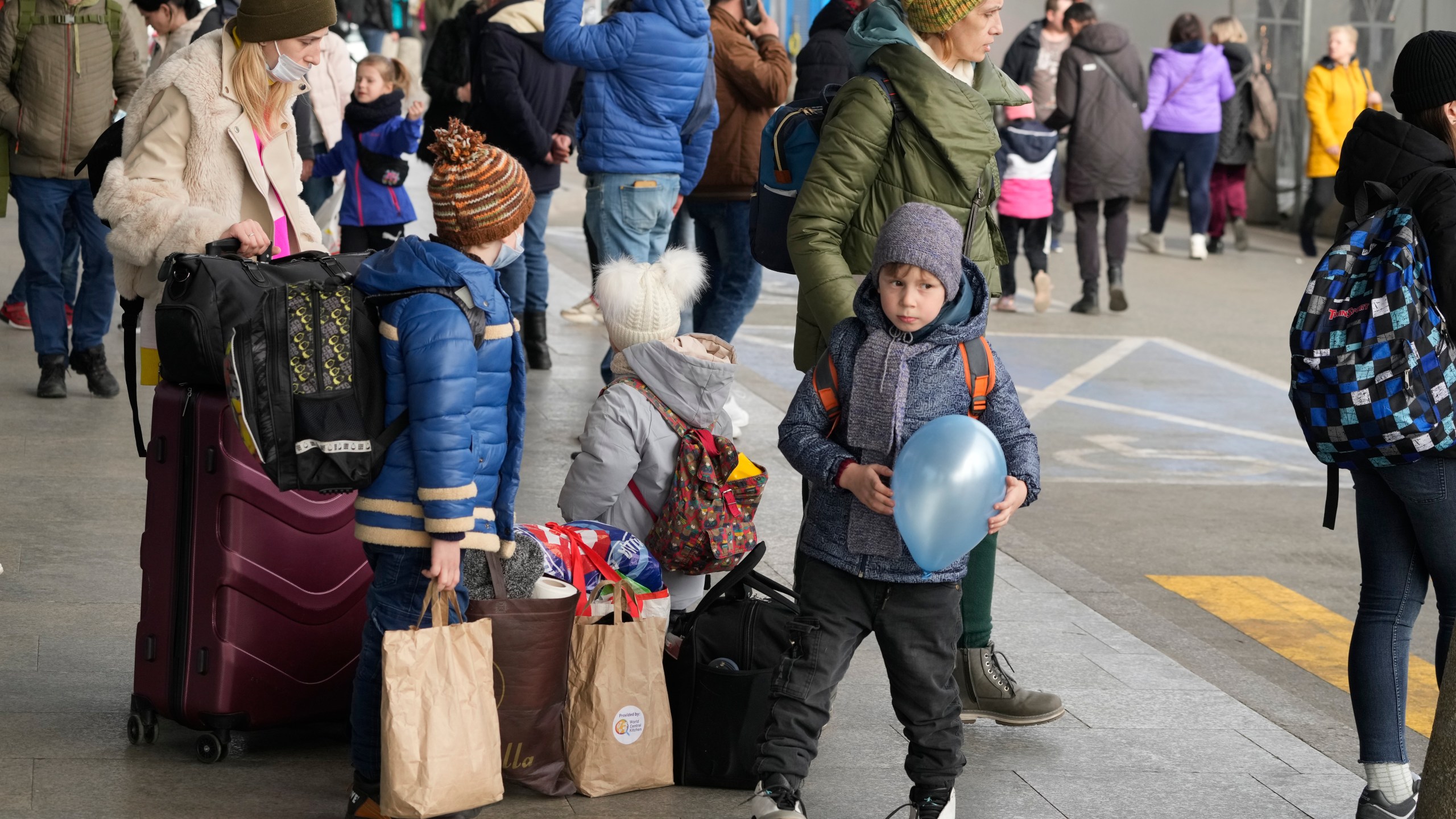 Ukrainian refugees wait for a transport at the central train station in Warsaw, Poland, Sunday, March 27, 2022. More than 3.7 million people have fled the war so far, Europe’s largest exodus since World War II. (AP Photo/Czarek Sokolowski)