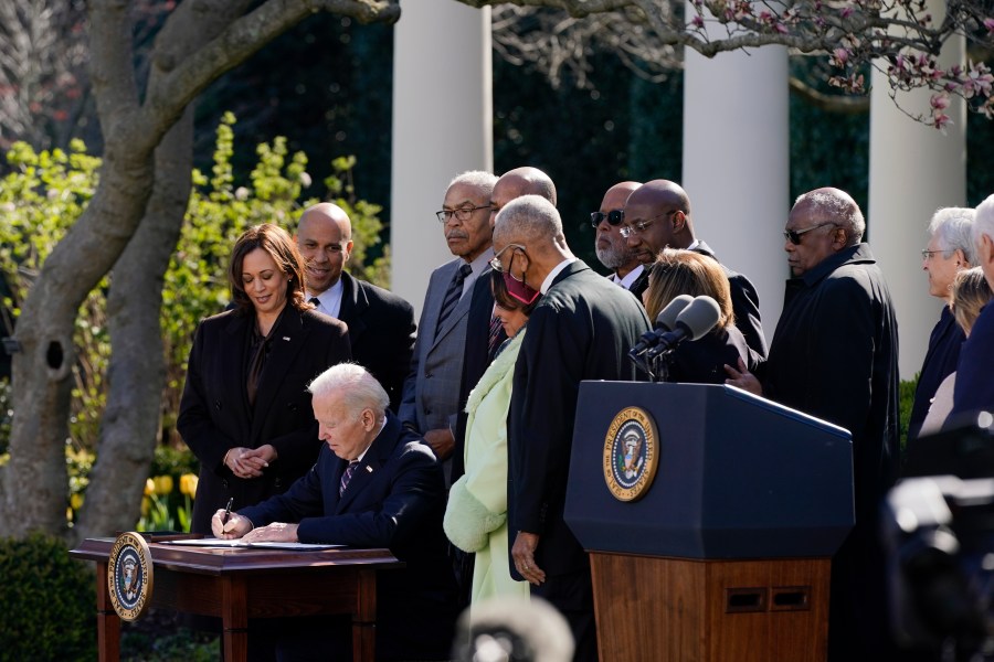 President Joe Biden signs the Emmett Till Anti-Lynching Act in the Rose Garden of the White House on March 29, 2022. (Patrick Semansky/Associated Press)