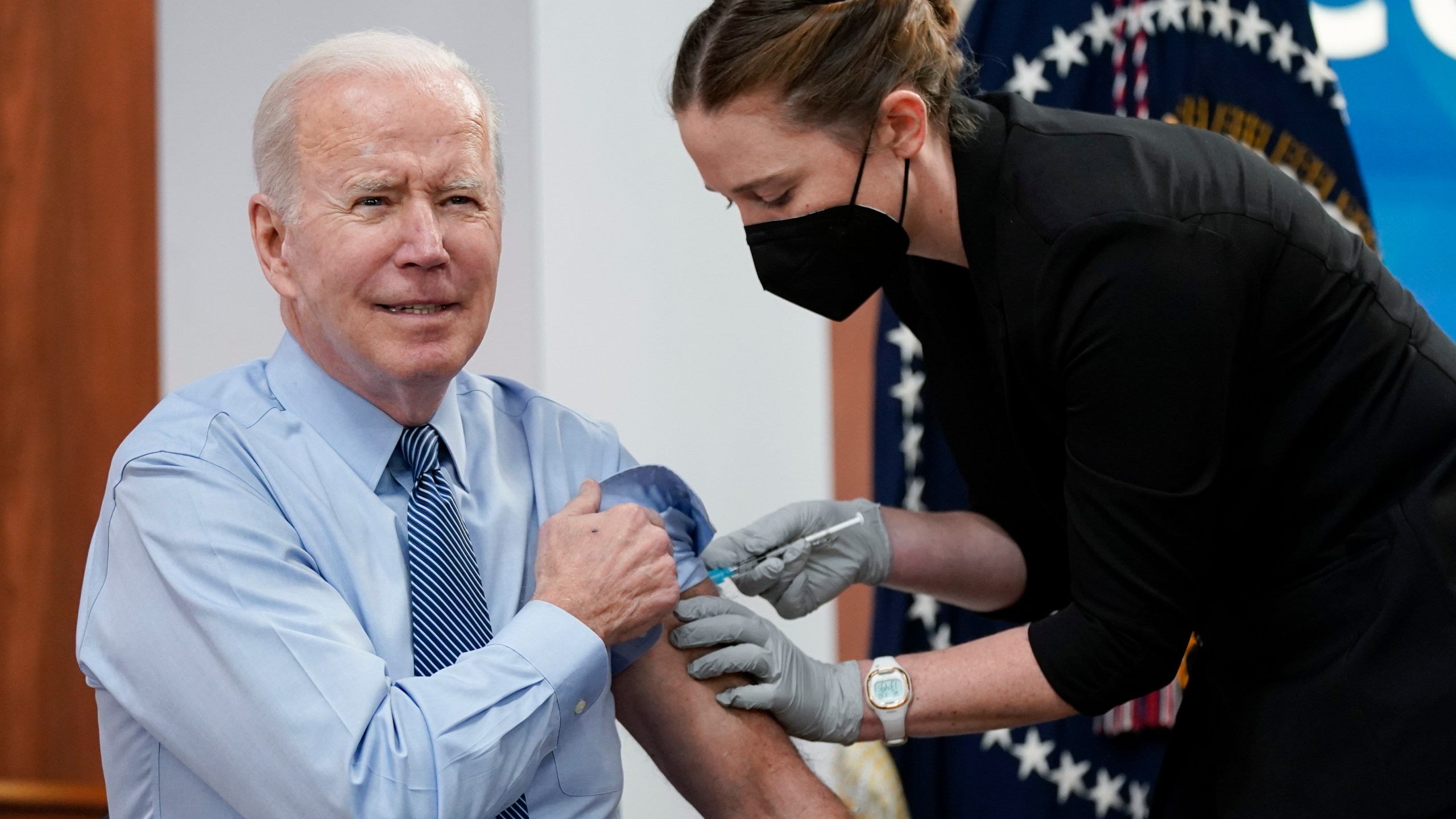 President Joe Biden receives his second COVID-19 booster shot in the South Court Auditorium on the White House campus on March 30, 2022, in Washington. (Patrick Semansky/Associated Press)