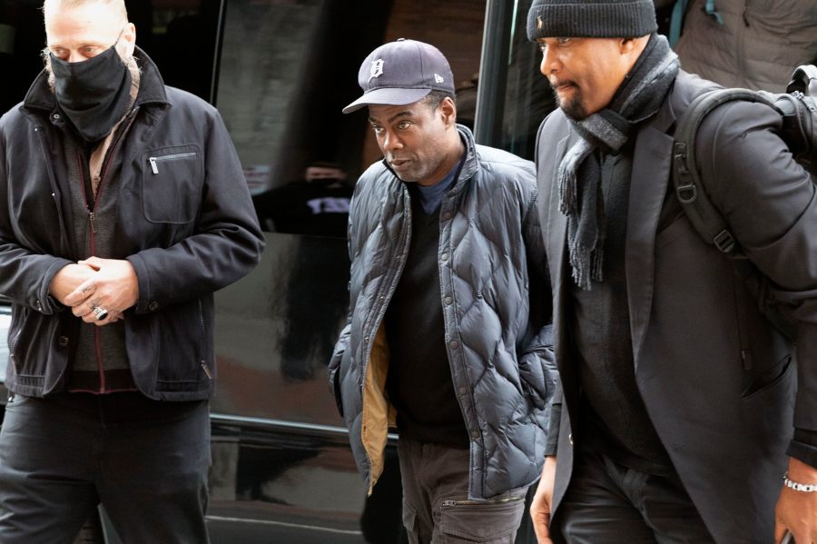 Chris Rock, center, arrives at the Wilbur Theater before a performance on March 30, 2022, in Boston. (AP Photo/Michael Dwyer)