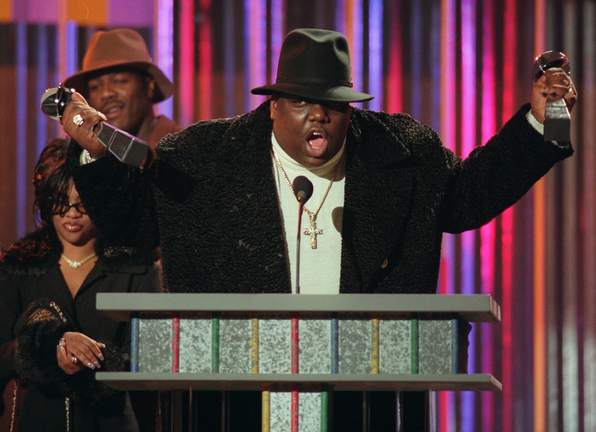 Notorious B.I.G., who won rap artist and rap single of the year, clutches his awards at the podium during the annual Billboard Music Awards in New York, in this Dec. 6, 1995, file photo. The family of slain rapper Notorious B.I.G. has filed a second wrongful-death lawsuit against the city, alleging that rogue Los Angeles police officers killed him 10 years ago. The lawsuit was filed Monday April 16, 2007 in Superior Court. (AP Photo/Mark Lennihan, File)