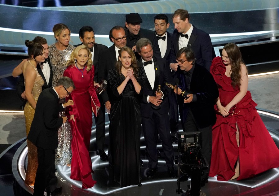 The cast and crew of "CODA" accept the award for best picture at the Oscars on Sunday, March 27, 2022, at the Dolby Theatre in Los Angeles. (AP Photo/Chris Pizzello)