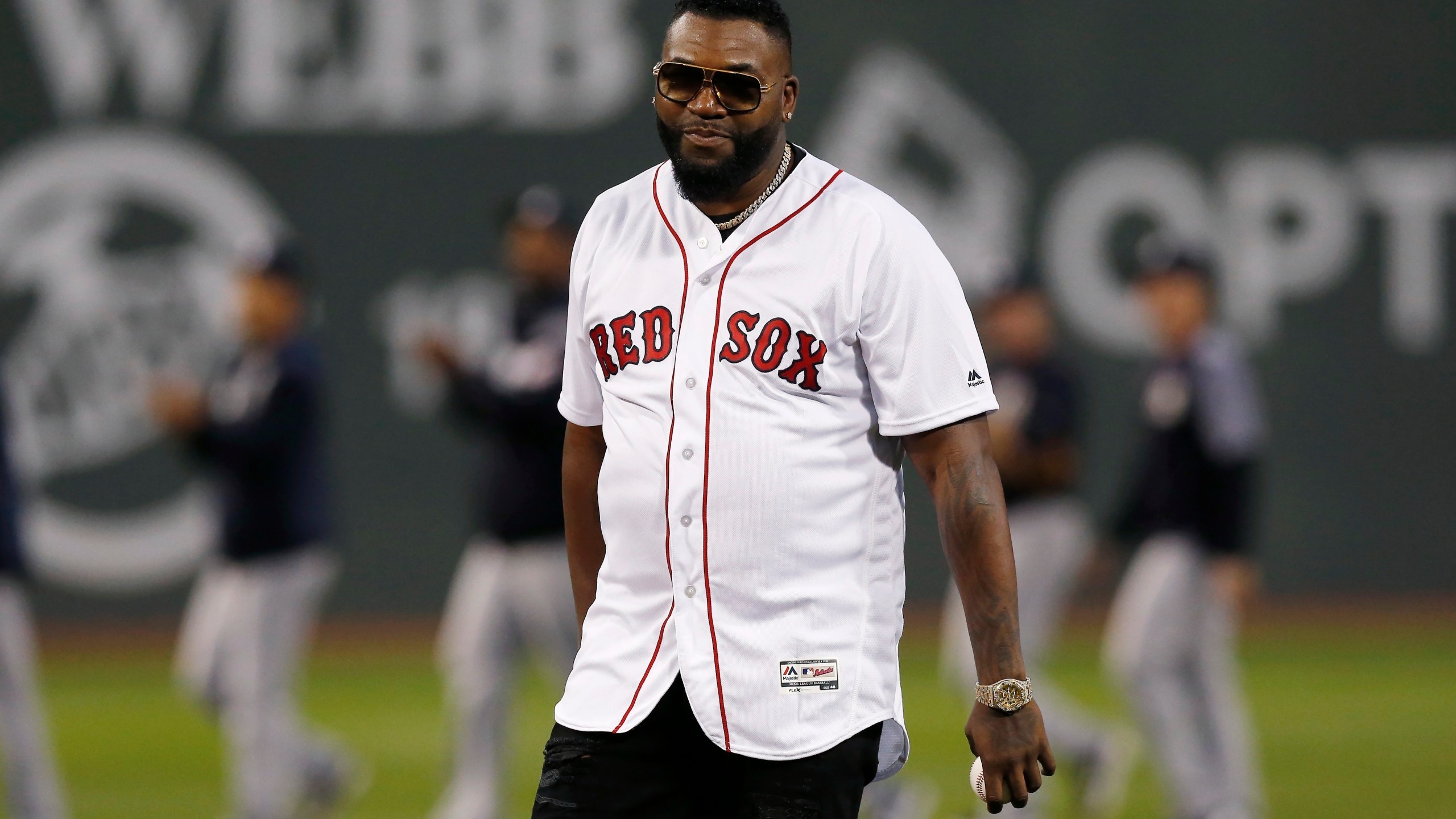 Former Boston Red Sox's David Ortiz prepares to throw out the ceremonial first pitch before a baseball game against the New York Yankees in Boston, Sept. 9, 2019. A Dominican drug trafficker orchestrated the shooting of Ortiz at a Dominican nightclub in 2019 because he felt disrespected by him and jealous, according to private investigators hired by Ortiz. (AP Photo/Michael Dwyer)