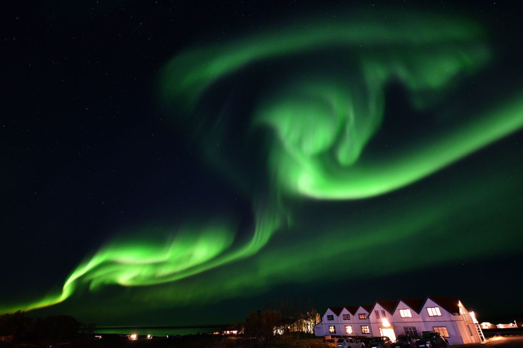 The aurora borealis, also known as northern lights, illuminates the sky along the Ring Road in southeastern Iceland, between Jokulsarlon glacier lagoon and Hofn, on Oct. 7, 2018. (MARIANA SUAREZ/AFP via Getty Images)