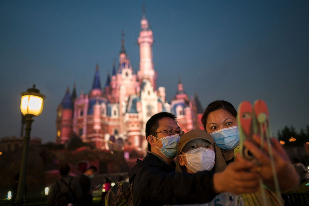 Tourists visit Shanghai Disneyland after its reopening on May 11, 2020 in Shanghai, China. (Photo by Hu Chengwei/Getty Images)