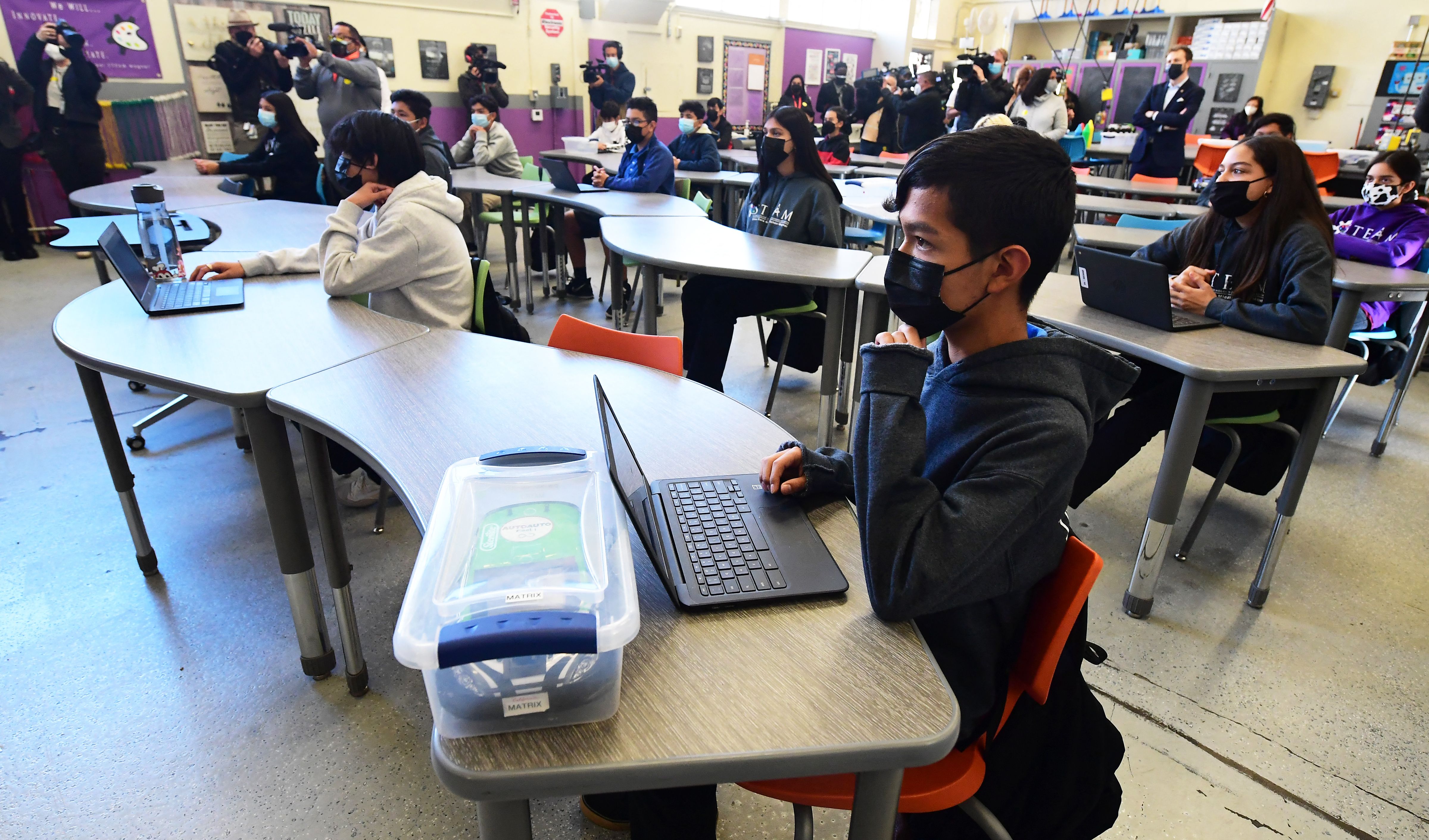 Seventh and eighth grades students attend a combined Advanced Engineering class at Olive Vista Middle School on the first day back following the winter break amid a dramatic surge in Covid-19 cases across Los Angeles County on January 11, 2022 in Sylmar, California. - Tens of thousands of Los Angeles Unified School District students returned to classes today after the winter break with district requirements for all staff and students to be tested for Covid-19 from the thousands of take-home test kits provided to students with a negative result allowing entry. (Photo by Frederic J. BROWN / AFP) (Photo by FREDERIC J. BROWN/AFP via Getty Images)