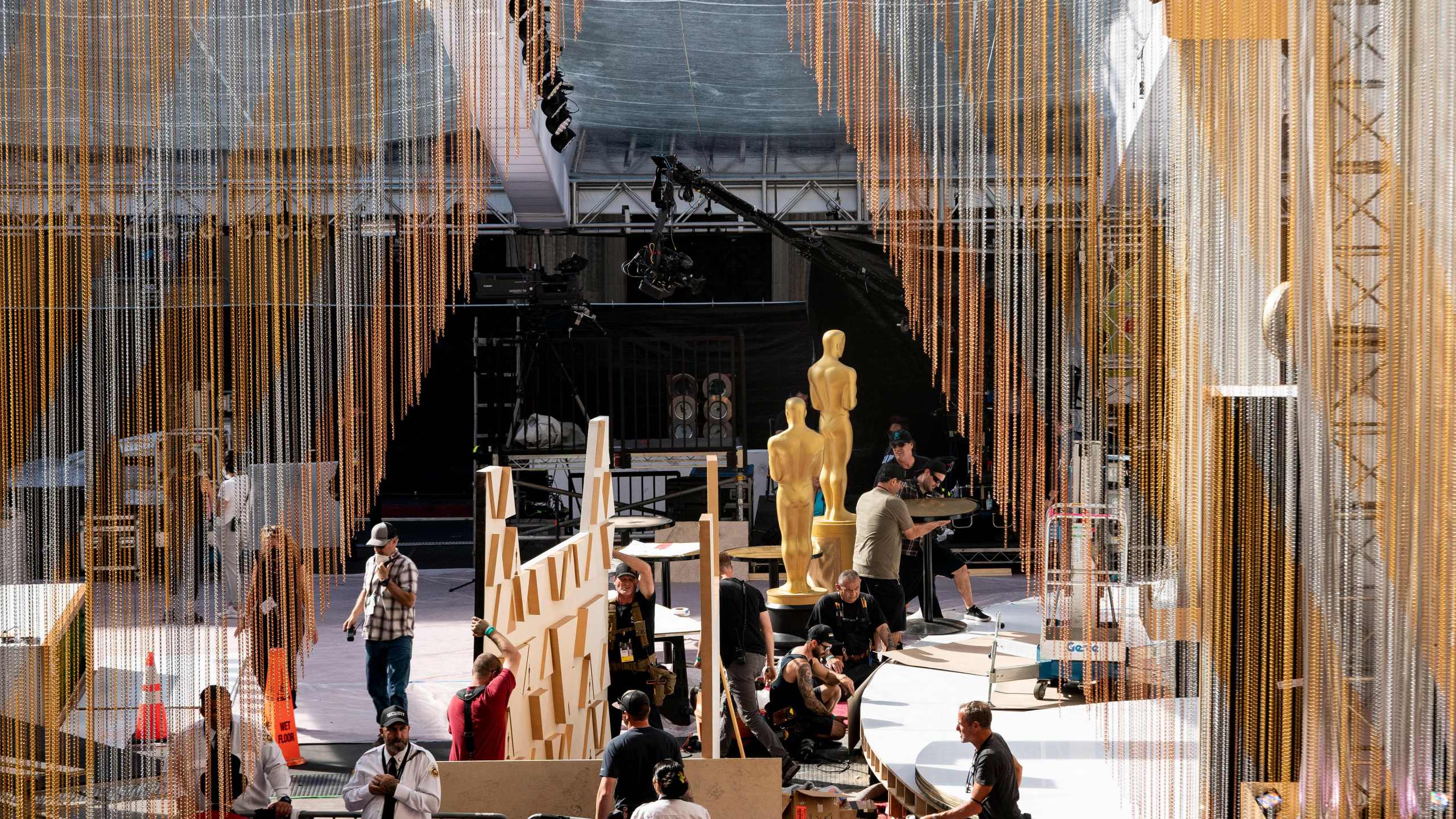 Workers prepare the red carpet near the Dolby Theater in Hollywood on March 25, 2022, in preparation for the Oscars. (STEFANI REYNOLDS/AFP via Getty Images)