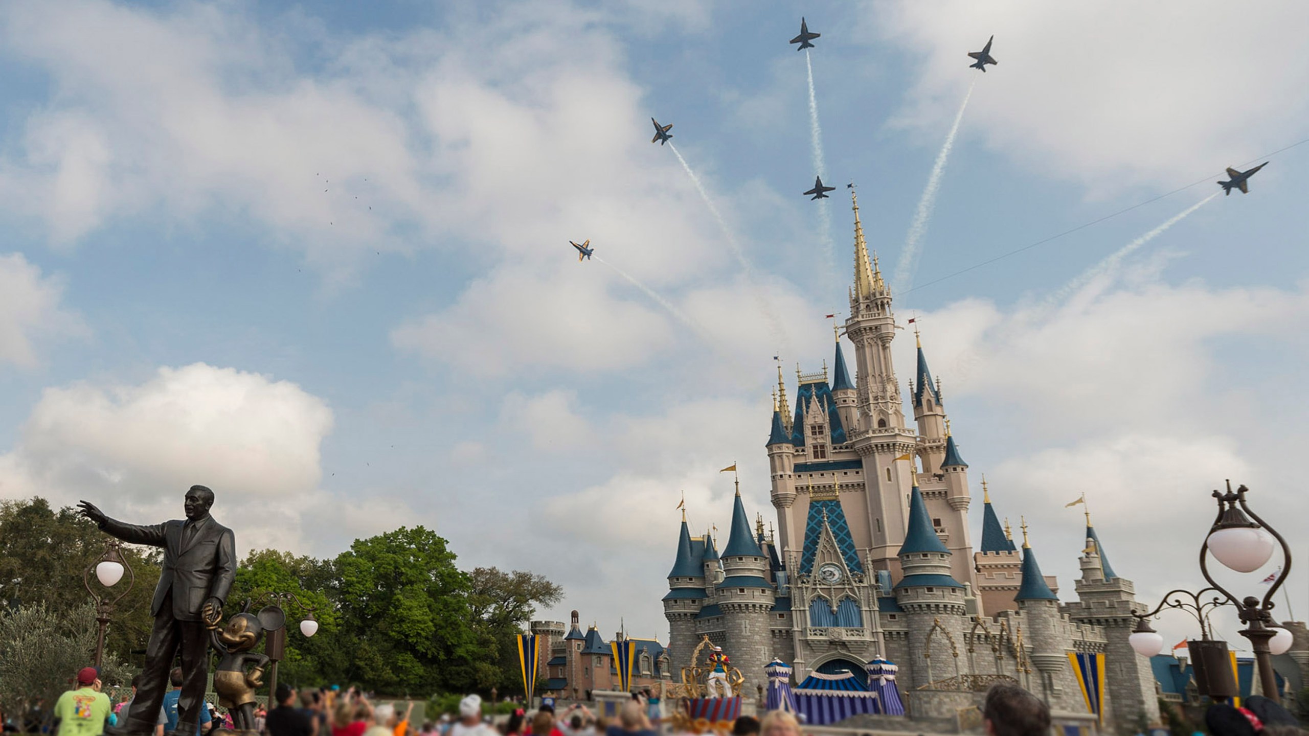 This handout file photo provided by Disney Parks shows the U.S. Navy Flight Demonstration Squadron, the Blue Angels, streaking across the skies above, Cinderella Castle March 19, 2015 at Walt Disney World Resort in Lake Buena Vista, Florida. (Mariah Wild/Disney Parks via Getty Images)