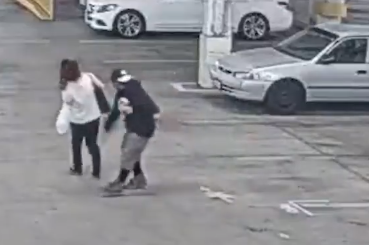 A surveillance still from video released by Glendale police on March 2, 2022 shows an assailant punching a woman in an unprovoked attack.