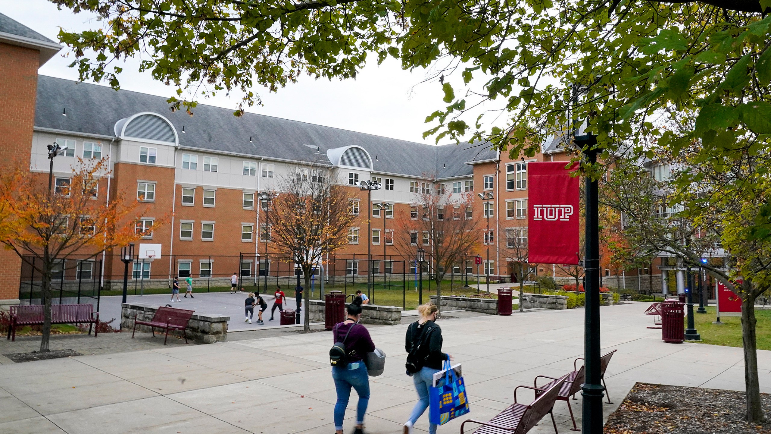 Students walk on the campus of Indiana University of Pennsylvania in Indiana, Pa. on Oct. 21, 2020. (Gene J. Puskar/Associated Press)