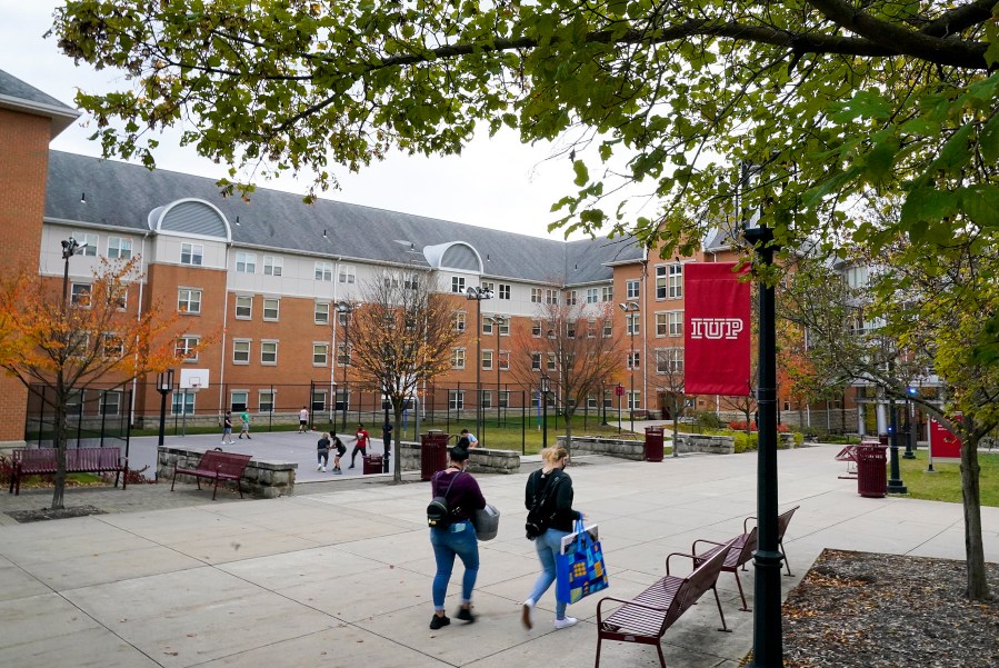 Students walk on the campus of Indiana University of Pennsylvania in Indiana, Pa. on Oct. 21, 2020. (Gene J. Puskar/Associated Press)